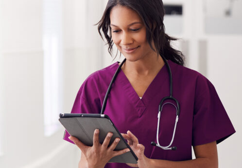 female medical staff using tablet