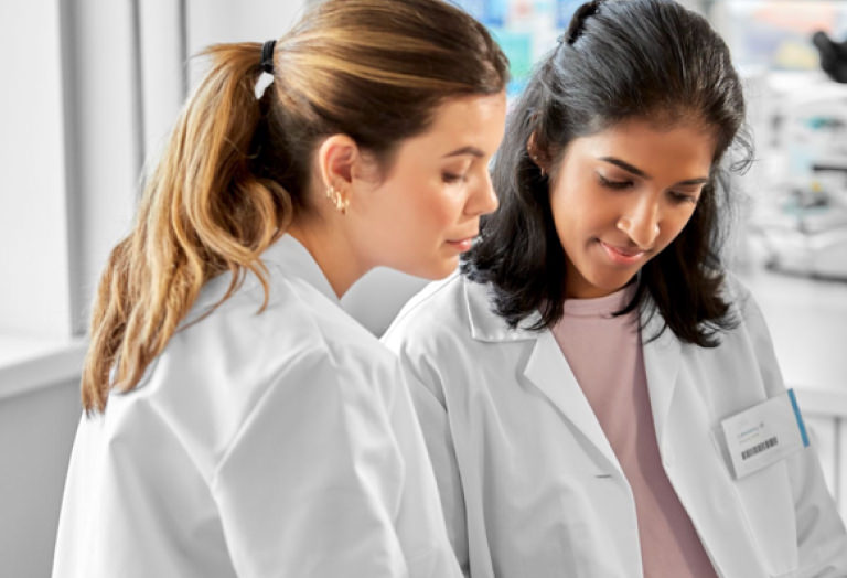 Academic medical‑center researchers collaborating in a lab or hospital setting on clinical studies.